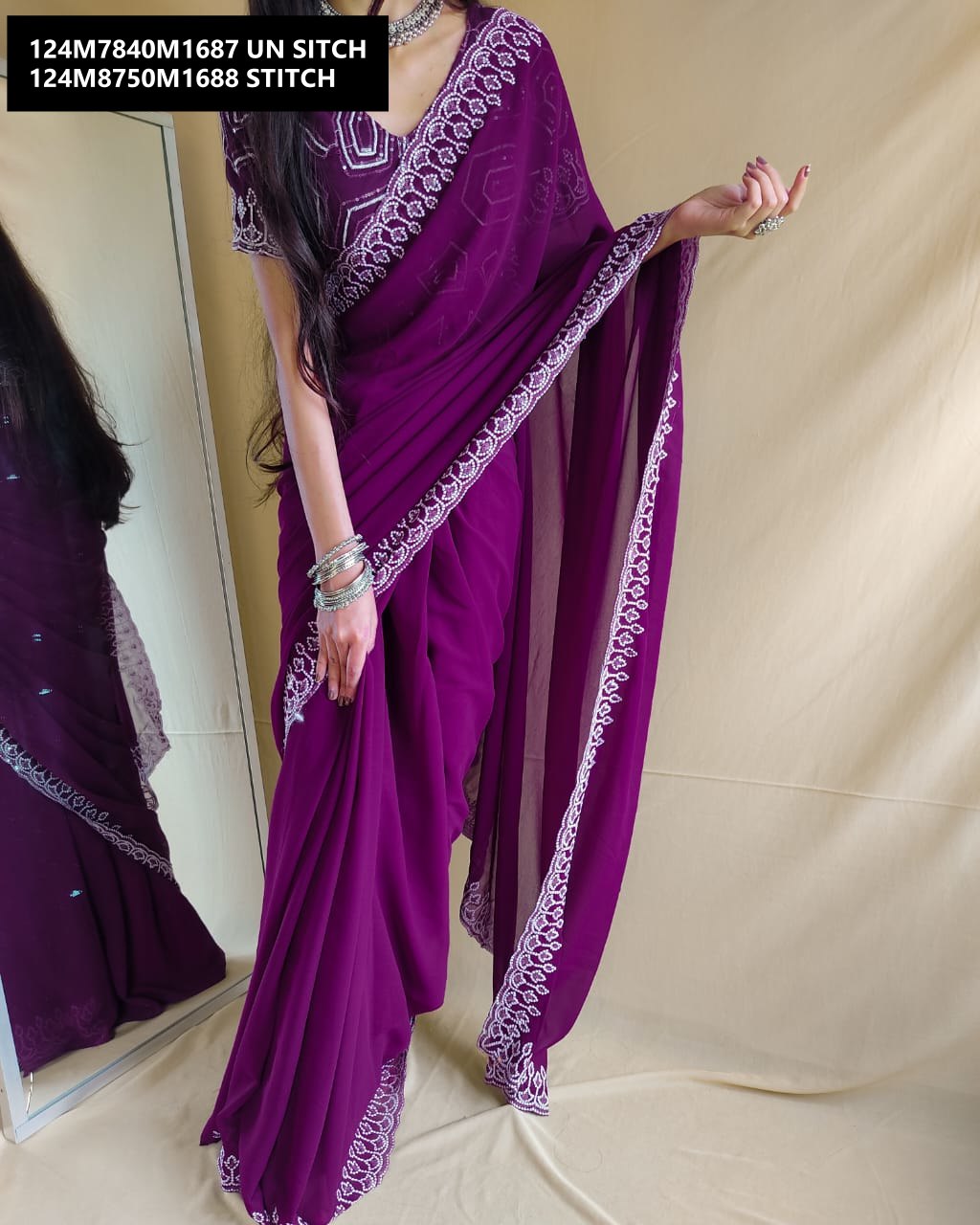 Model gracefully posing in the TRENDBUY Regal Plum Georgette Saree, displaying the fluid movement and the radiant sequin work.