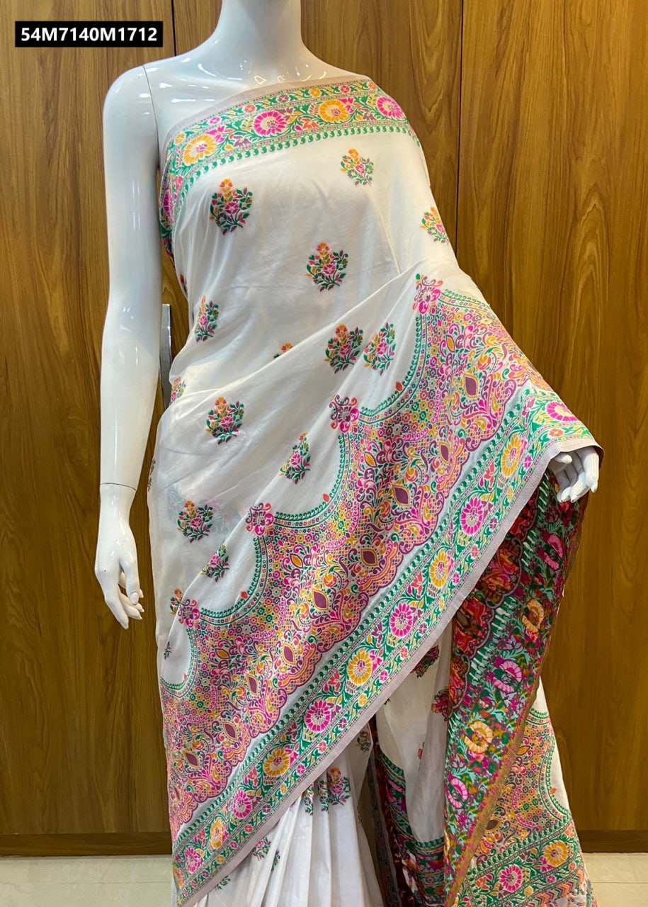 A mannequin draped in the elegant white Pashmina saree, highlighting the one-shoulder style, with the vibrant multi-color woven border and pallu draped gracefully over the arm.