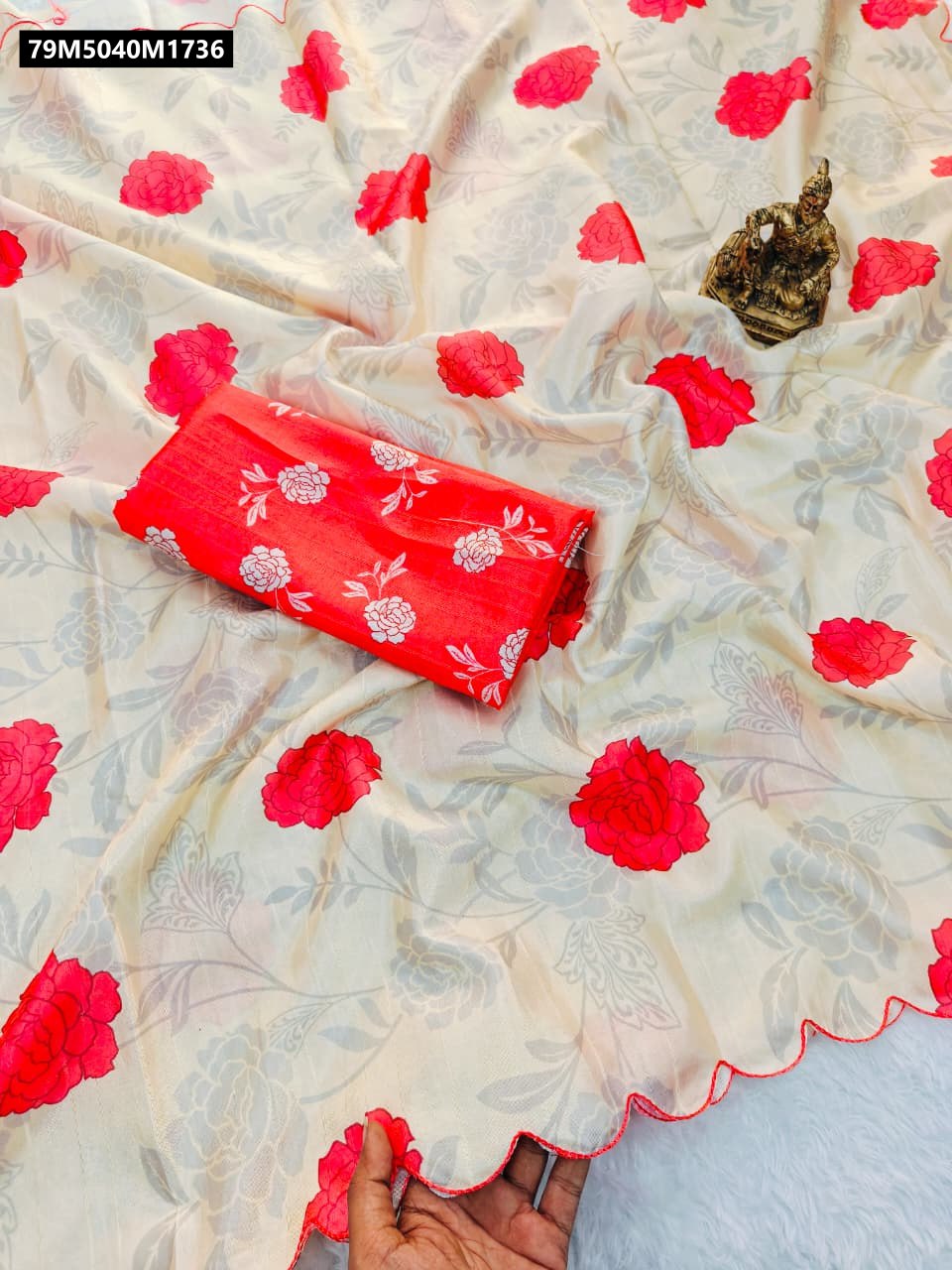 TRENDBUY Eternal Rose Handloom Tussar Silk Saree, showcasing its intricate rose digital print and unique arco border, neatly folded with its matching red blouse.
