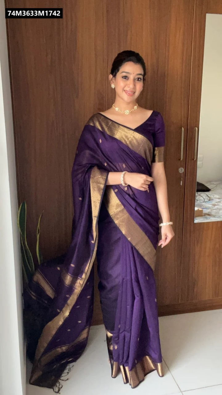 TRENDBUY Regal Purple Lilan Cotton Saree worn by a smiling model, standing front-facing, showcasing the rich golden border and delicate drape.