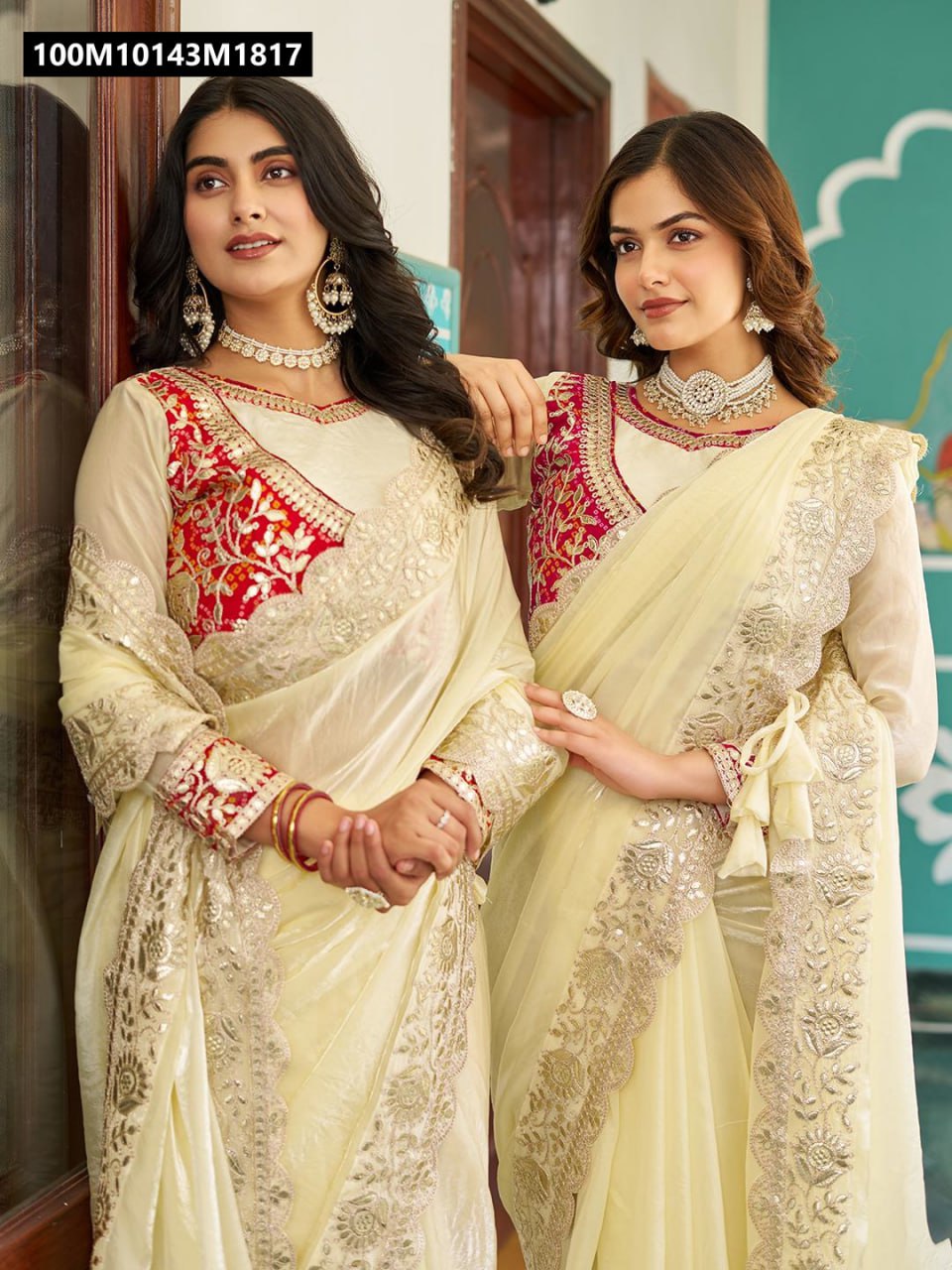 Two models showcasing the Vanilla Cream Pure Fendy Saree, one with hands clasped, the other with a hand on her shoulder, displaying the versatility and elegance of the design.