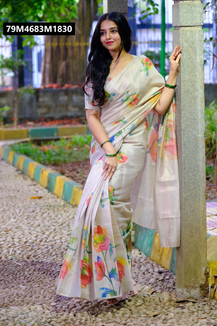 Full-length shot of the elegant model standing outdoors, leaning against a pillar, beautifully draped in the TRENDBUY cream tussar silk saree with its captivating digital tulip design.