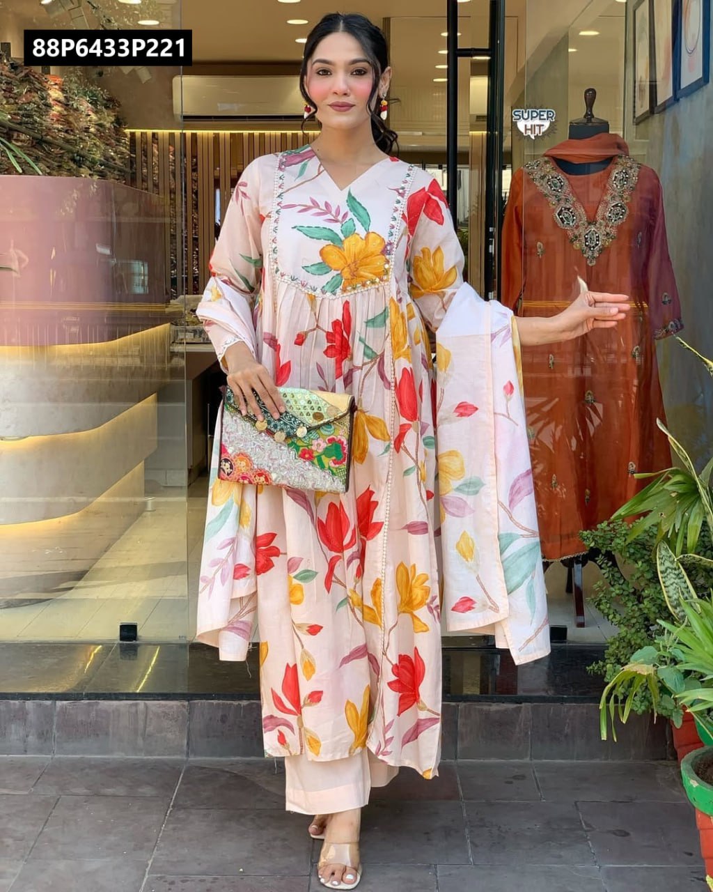 Full body frontal view of TRENDBUY model confidently showcasing a light cream floral print D cotton kurti set with matching bottom and gracefully draped maslin dupatta.