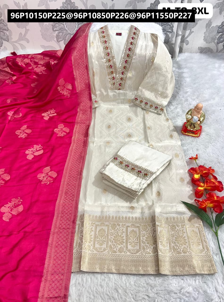 TRENDBUY Cream Chanderi Kurta Set with heavy handwork, silk pants, and a vibrant fuchsia chanderi dupatta featuring jacquard border, displayed on white fur.