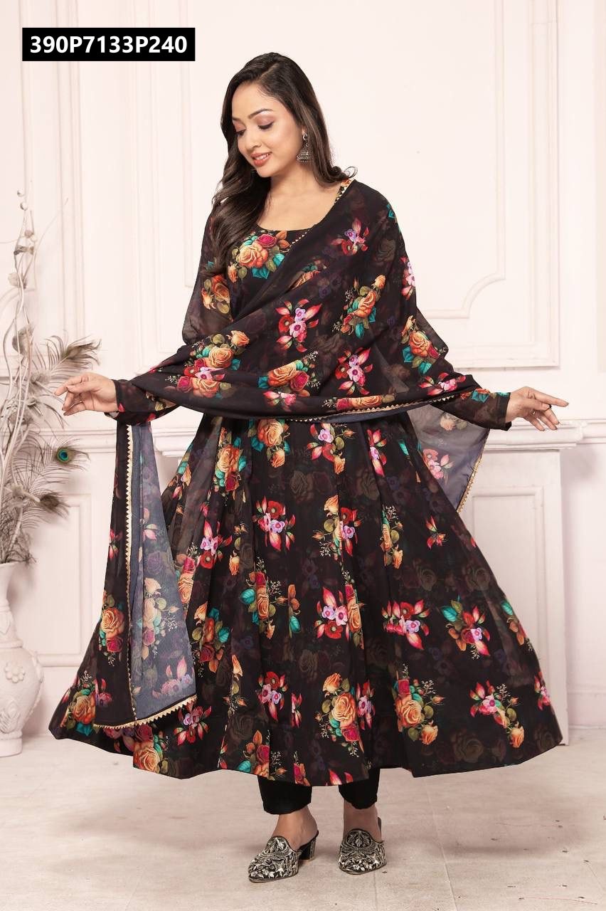 Full body shot of a model elegantly posing, wearing the TRENDBUY black multi-floral Anarkali suit set with a flowing matching dupatta.