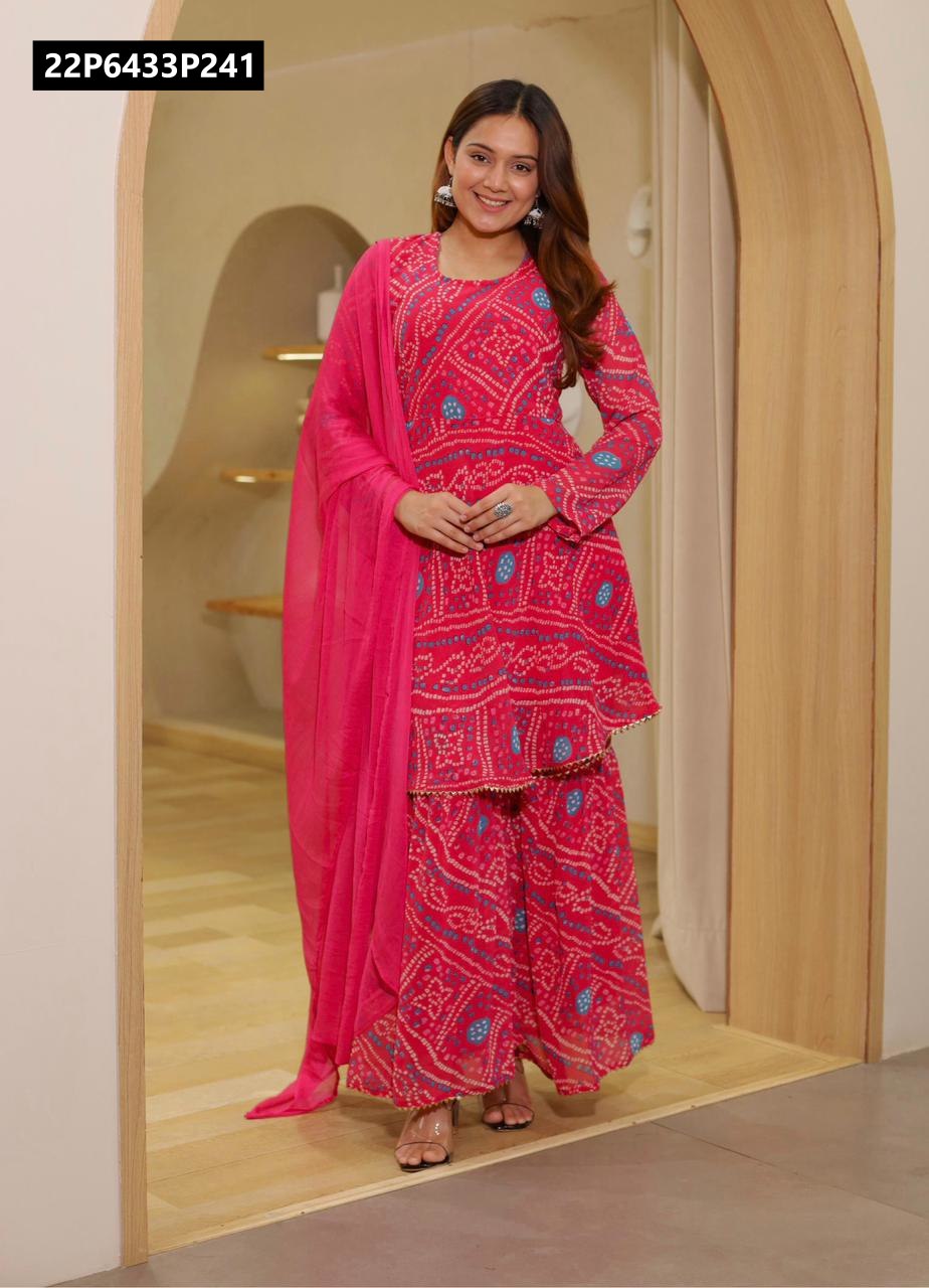 Model striking a pose in a beautiful hot pink TRENDBUY Faux Georgette Bandhani Print Sharara Suit with matching dupatta