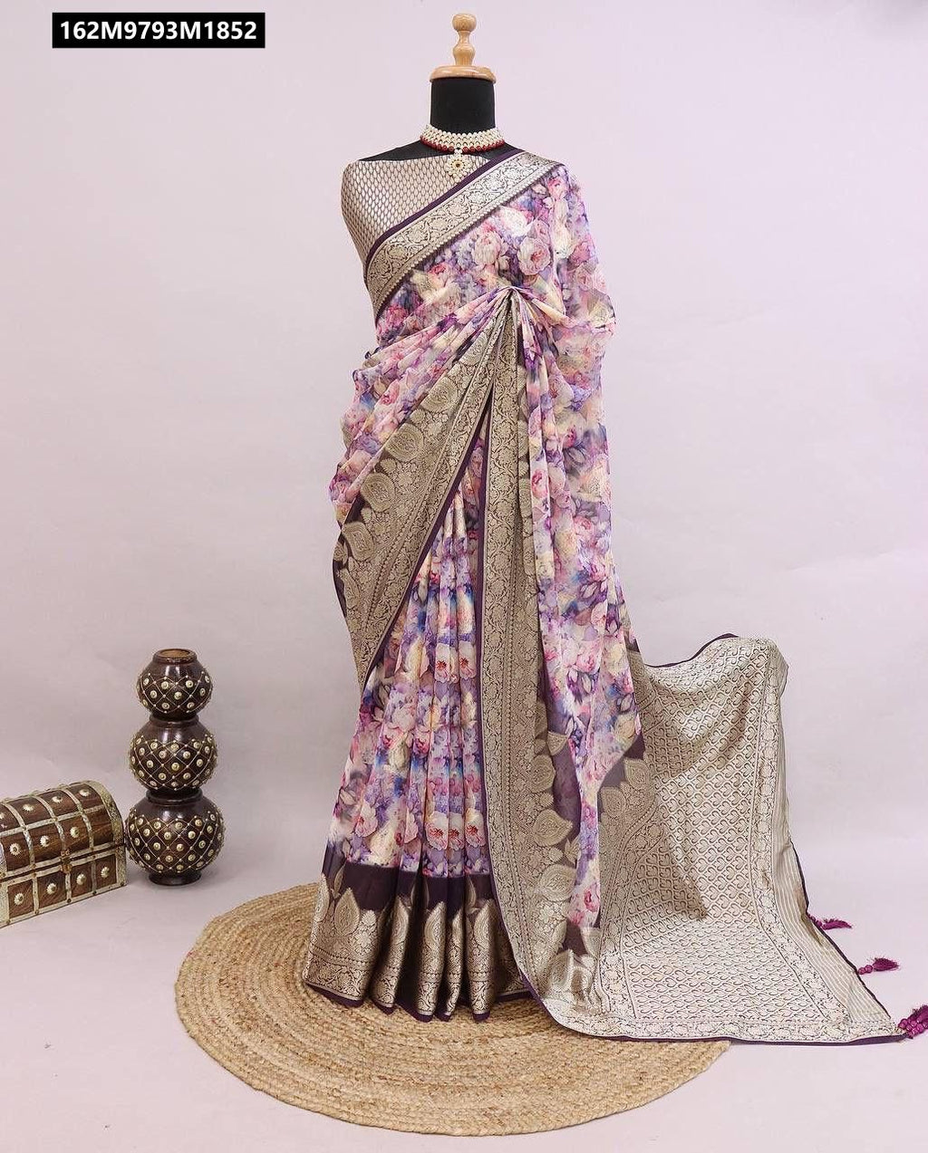 TRENDBUY Blossom Bliss Georgette Silk Saree in lavender multi-floral digital print with dark purple border and weaved blouse, draped on a mannequin.
