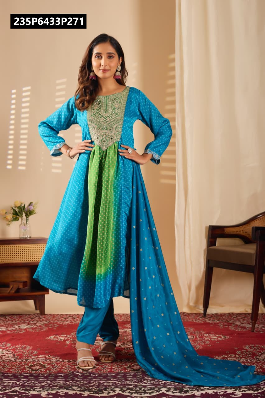 Full-length frontal shot of a model standing confidently in a teal green Viscose Chinon kurta set, displaying intricate sequence embroidery and real mirrors.