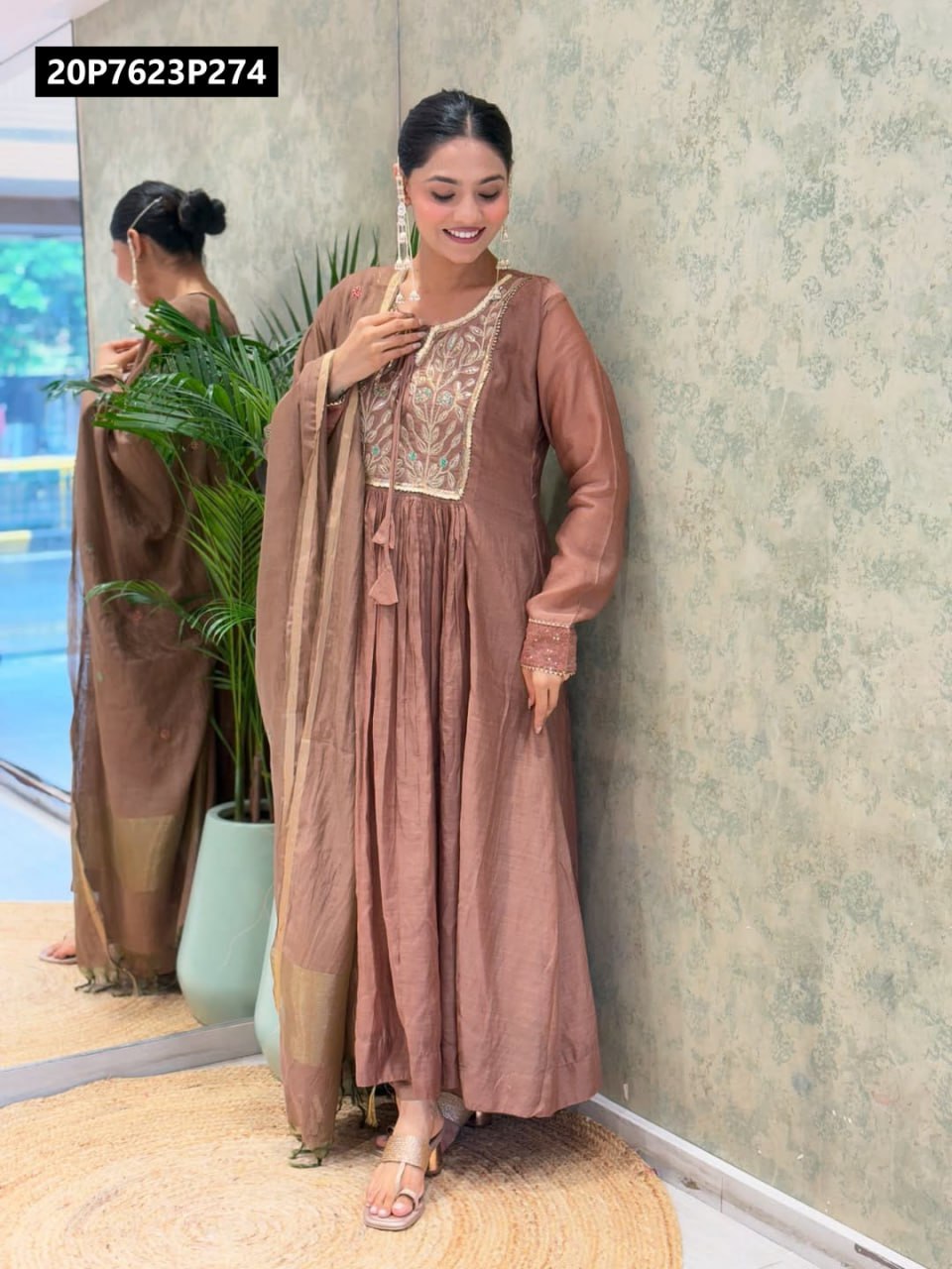 Full-body shot of model wearing TRENDBUY Dusty Rose Mul Chanderi Anarkali Kurti Set, with detailed embroidery and Banarasi dupatta, smiling in a well-lit room.