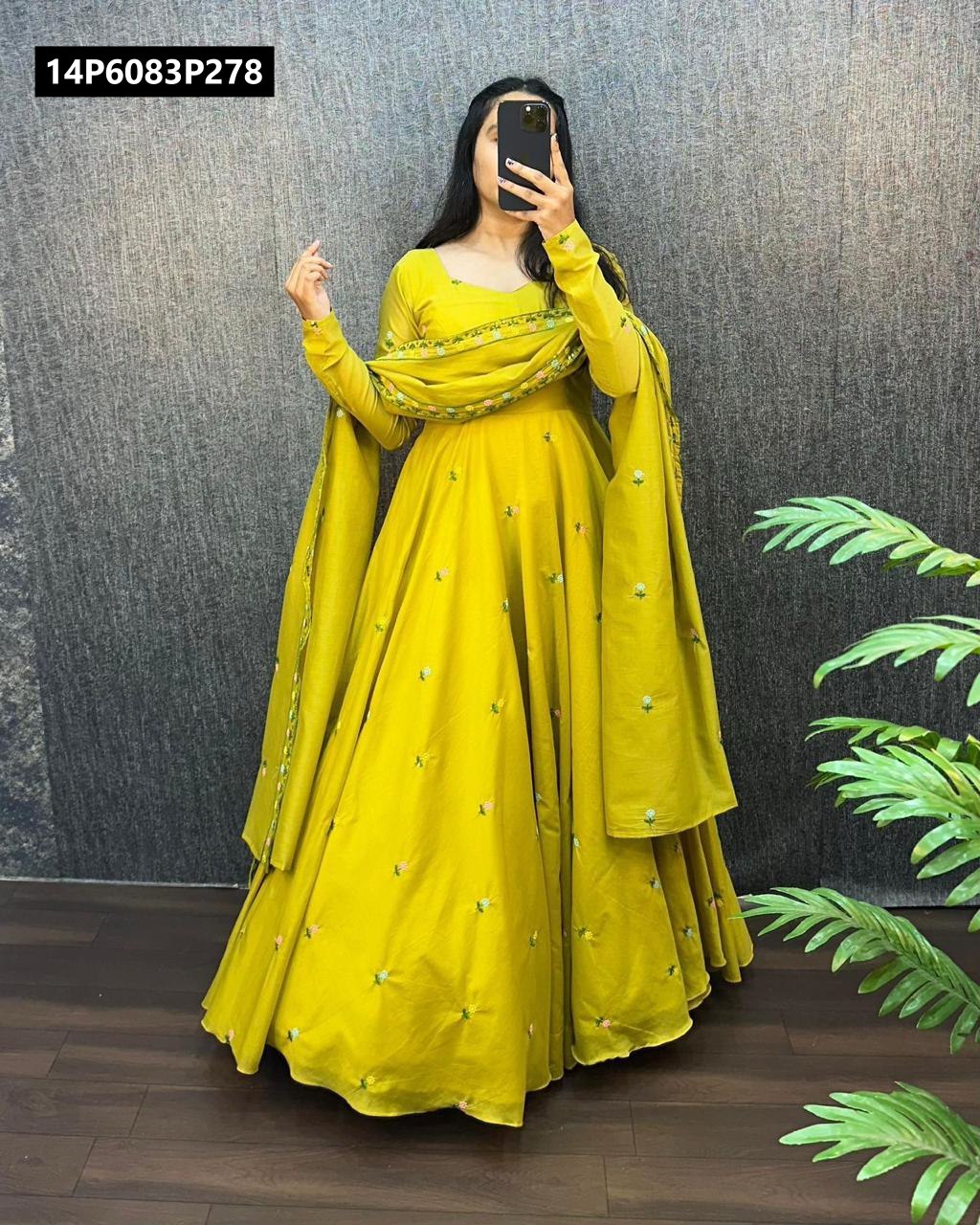 Full-length shot of a model gracefully posing in a rich purple TRENDBUY Zipsy Silk gown with full sleeves and a matching embroidered dupatta, ready for a special occasion.