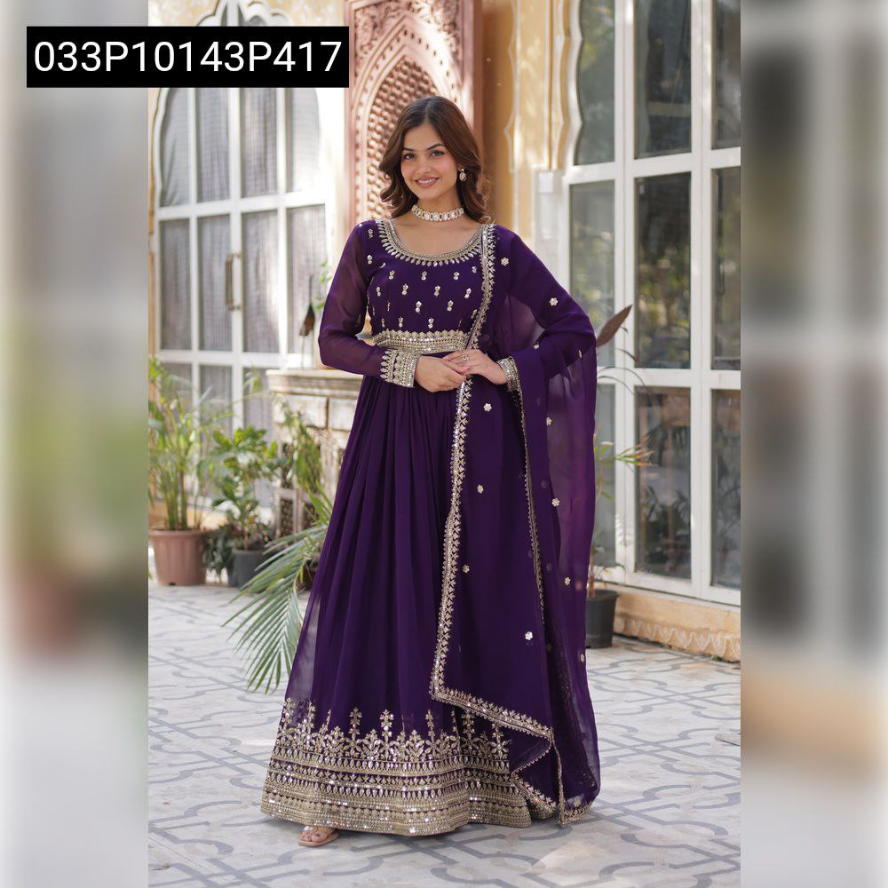 TRENDBUY model in a stunning purple Faux Blooming Anarkali gown with golden zari and sequin embroidery, posing gracefully outdoors.