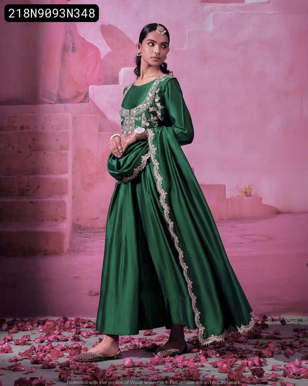 Model posing gracefully in TRENDBUY Green Embroidered Chinon Silk Gown set with dupatta, full shot against pink steps background