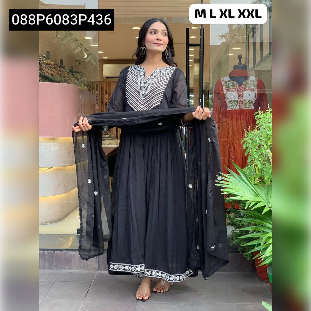 Full body view of model in TRENDBUY black cotton flared kurta set, showcasing the flow and design, outside store