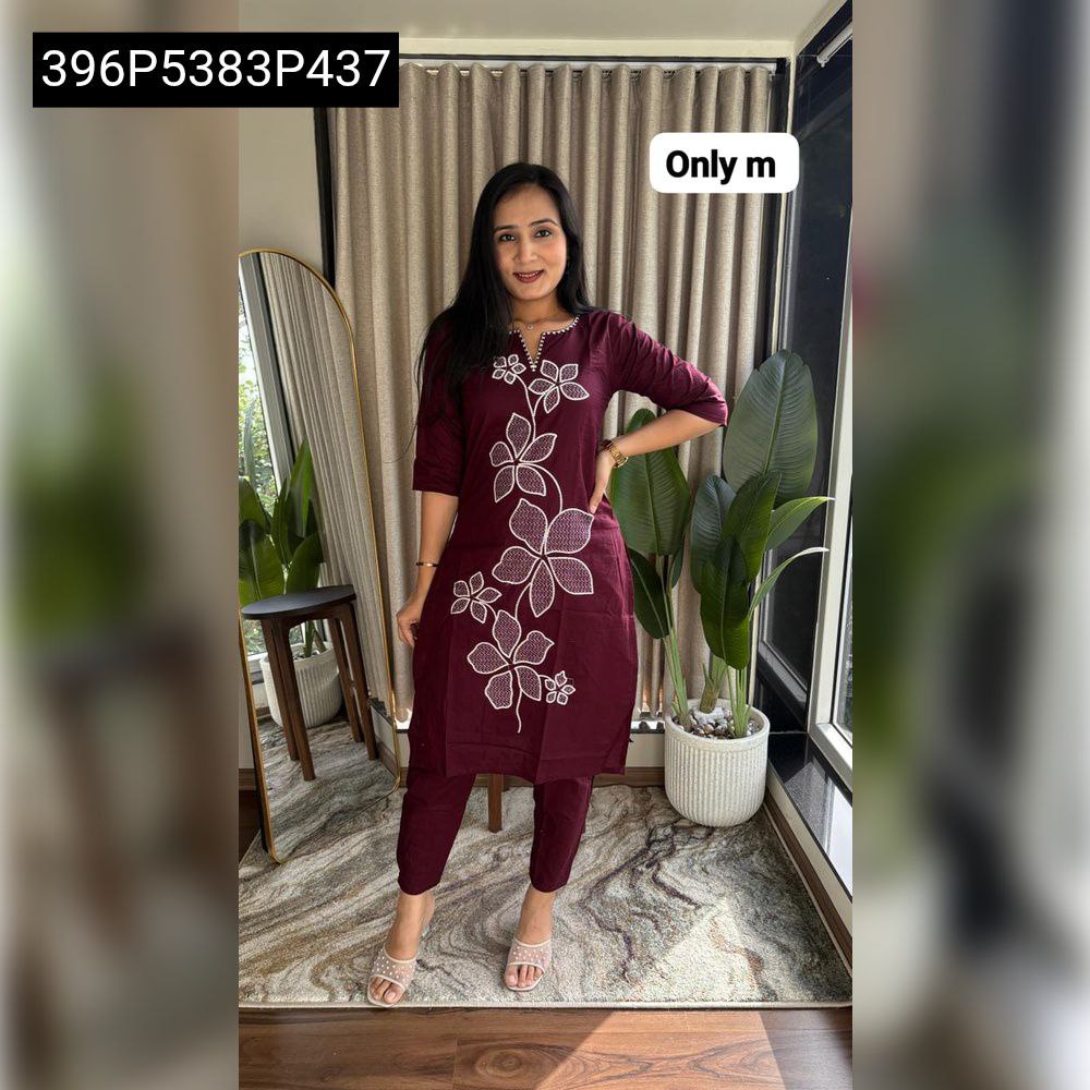 TRENDBUY women's maroon kurti with white floral chikan work embroidery, paired with matching plazo pants, model full shot.