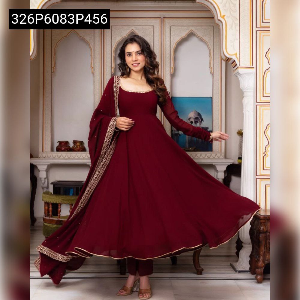Model twirling to demonstrate the beautiful flare and full silhouette of the TRENDBUY Maroon Georgette Anarkali Gown, paired with its embroidered dupatta.