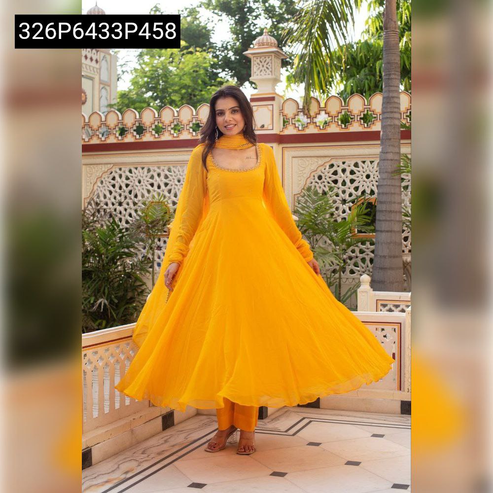 A model gracefully twirling in the full-flared yellow TRENDBUY Georgette Anarkali suit, demonstrating its voluminous silhouette, outdoors.