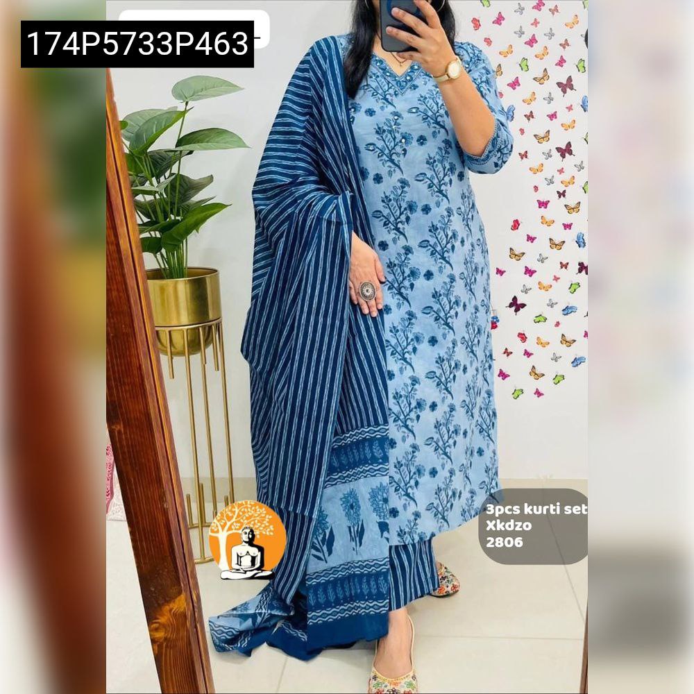 TRENDBUY women's Sky Blue pure cotton 60-60 kurti set with floral print and striped dupatta, modelled full length against a plant and butterfly wall.