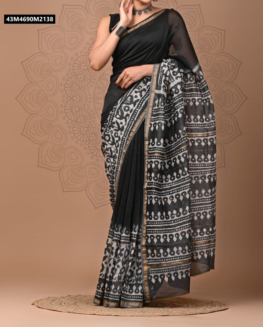 Model draped in a TRENDBUY Black & White Chanderi Silk Saree with abstract tribal digital print, gold zari border, styled with a black blouse and chunky silver bangles.