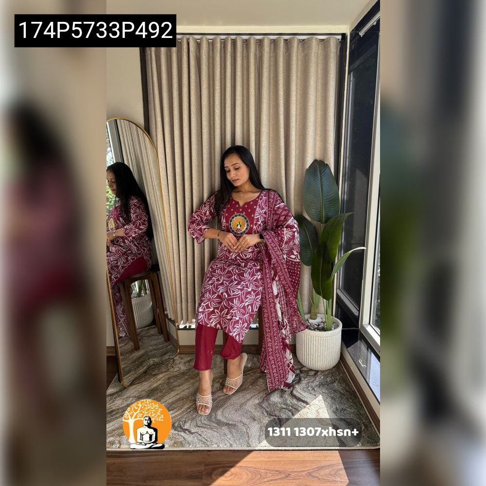 TRENDBUY model in maroon pure cotton kurti set with printed dupatta, solid pants, and an intricate circular motif embroidery on chest, posing elegantly indoors.