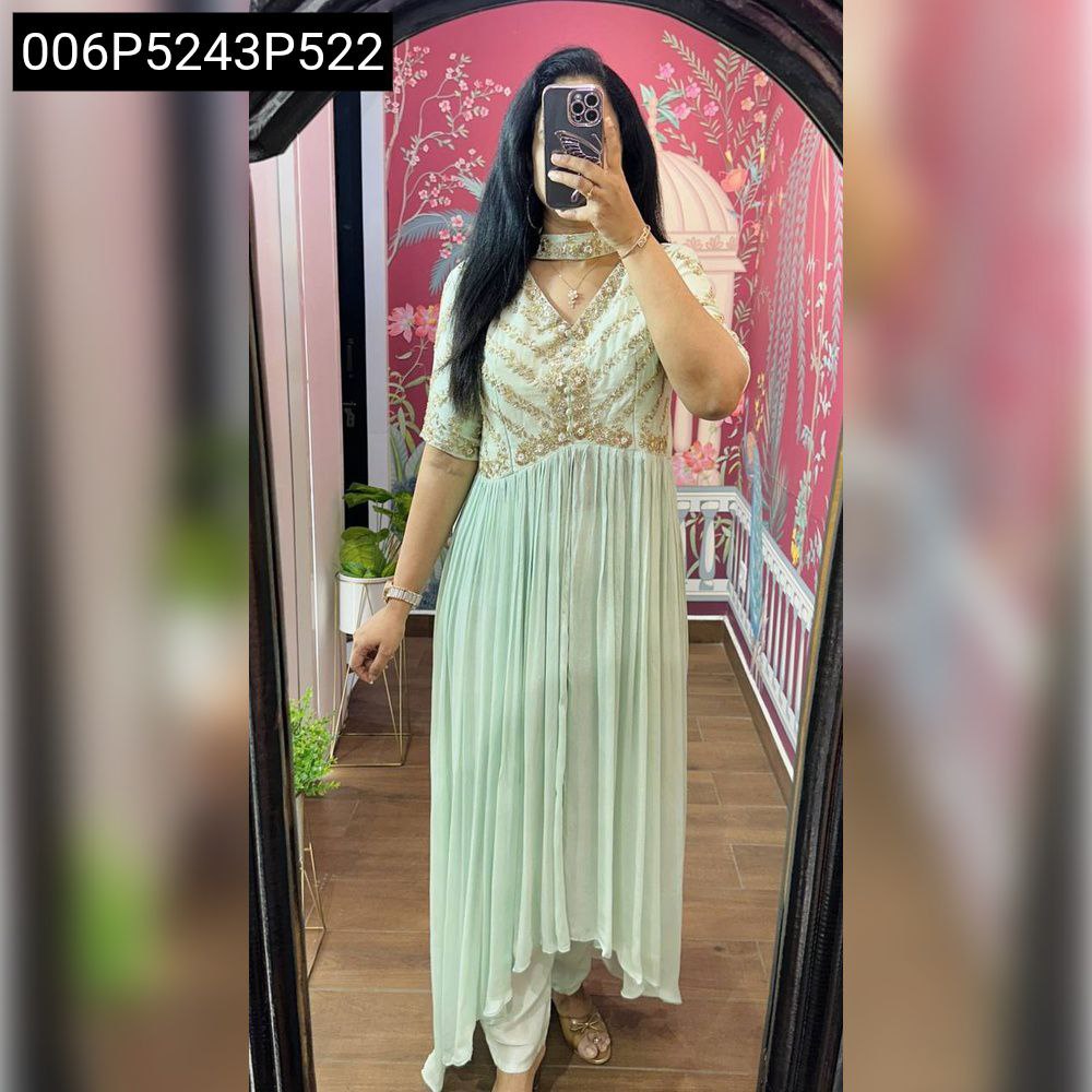 Model wearing a TRENDBUY Mint Green Fox Georgette Anarkali Kurta Set with elaborate sequence and thread work on the yoke, captured in a mirror reflection.