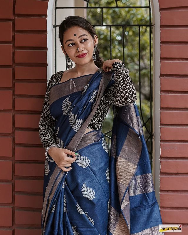 Banarsi soft silk saree with copper jari leaf weaving and jacquard blouse.