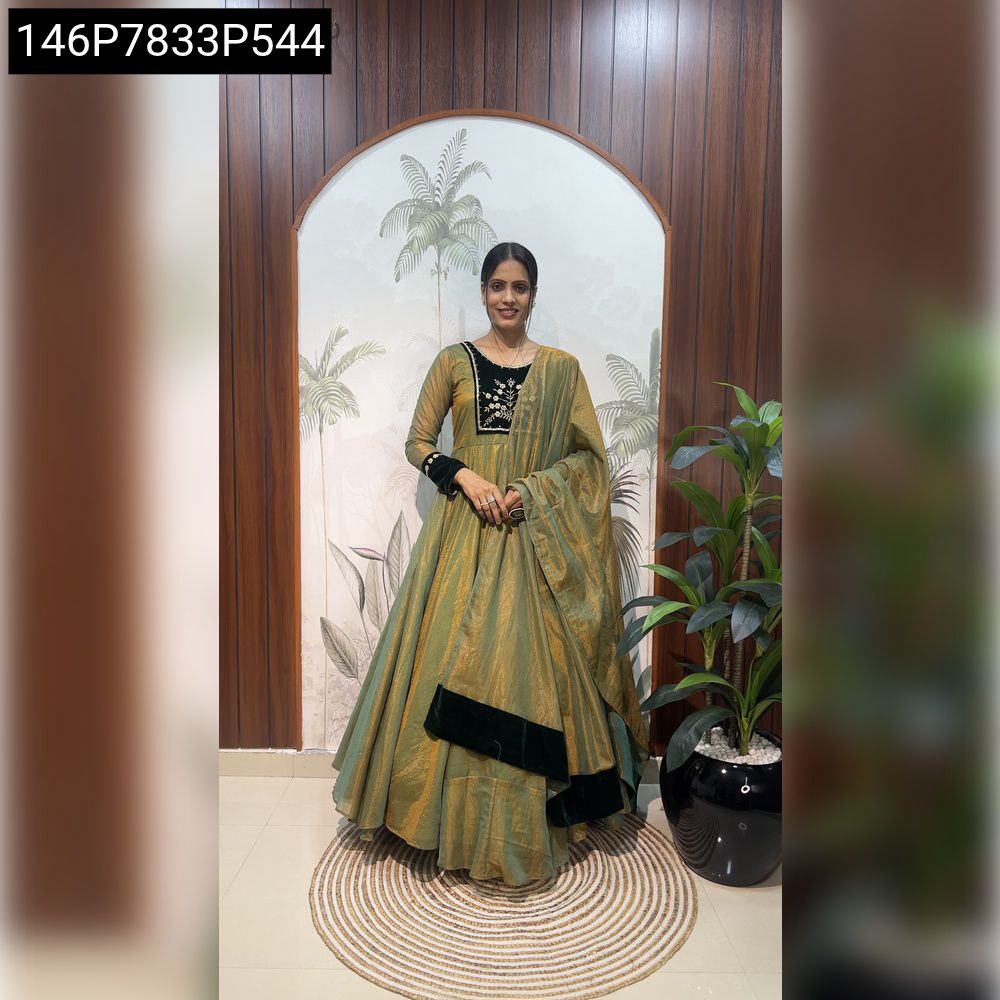 Captivating full-body shot of the model in the olive green TRENDBUY embroidered Fendy Tissue Silk gown, smiling directly at the camera.