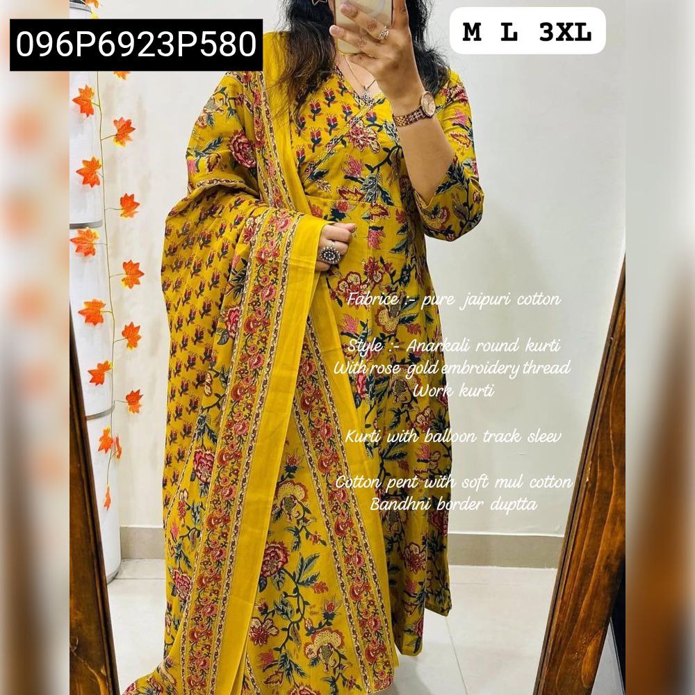 Model showcasing a vibrant Mustard Yellow TRENDBUY Anarkali Kurta Set with floral print, embroidered neckline, and malmal dupatta.