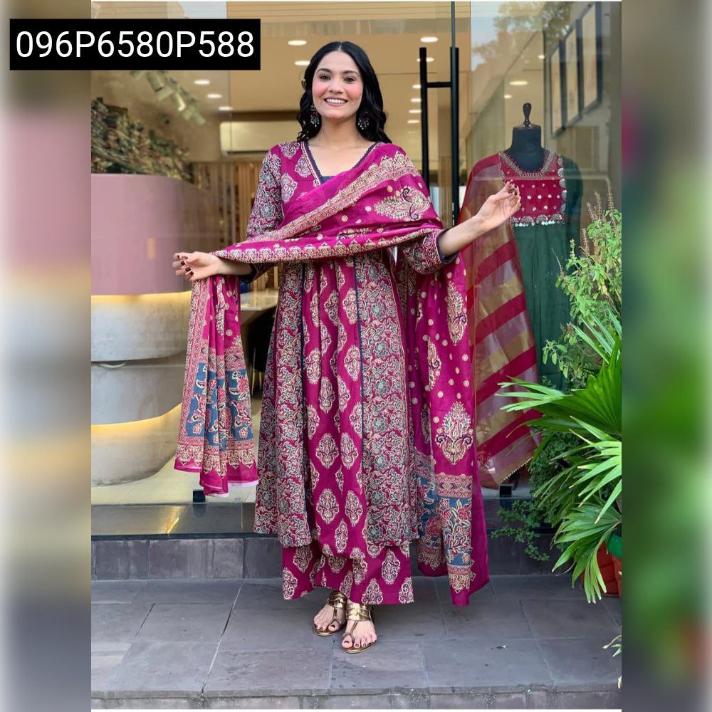 Smiling model showcasing TRENDBUY pink cotton A-line kurti set with dupatta and traditional print, full body shot outdoors