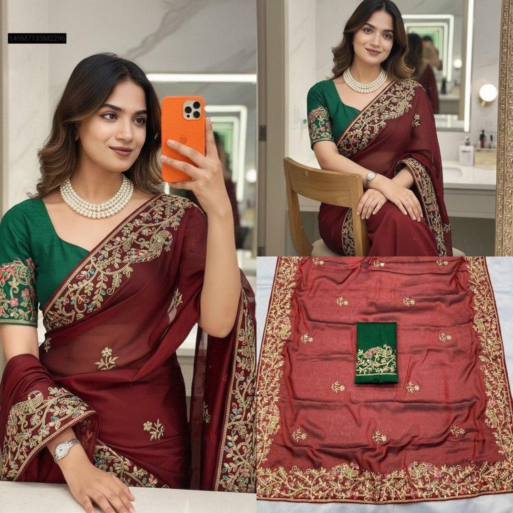 Model in maroon Rangoli silk saree with green embroidered blouse, taking a mirror selfie.