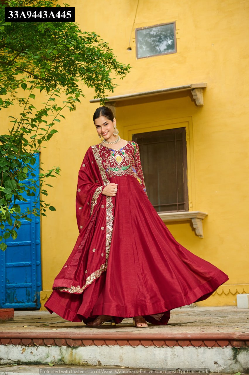 Model swirling gracefully in the Maroon embroidered Vichitra Anarkali Gown, showing its magnificent flair.