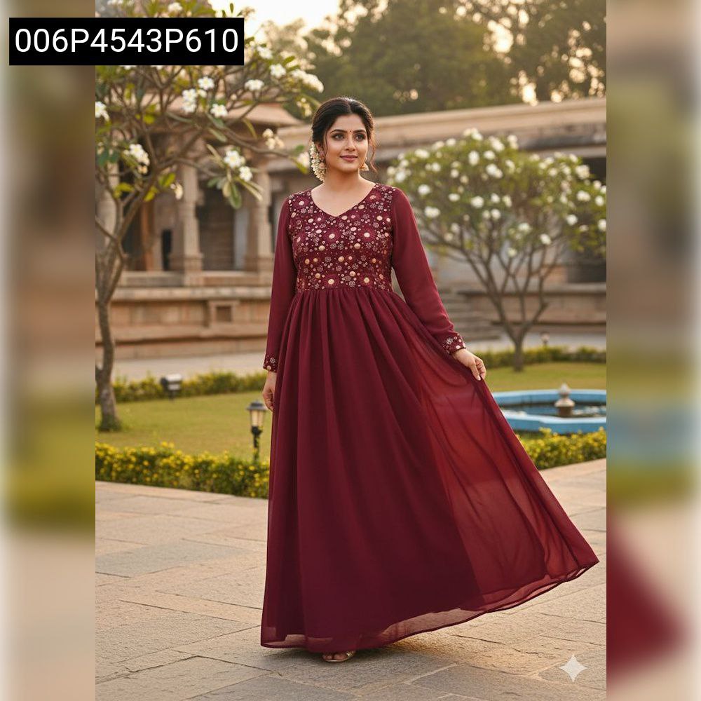 TRENDBUY Maroon Georgette Anarkali Gown with golden embroidery, model standing gracefully in a garden setting