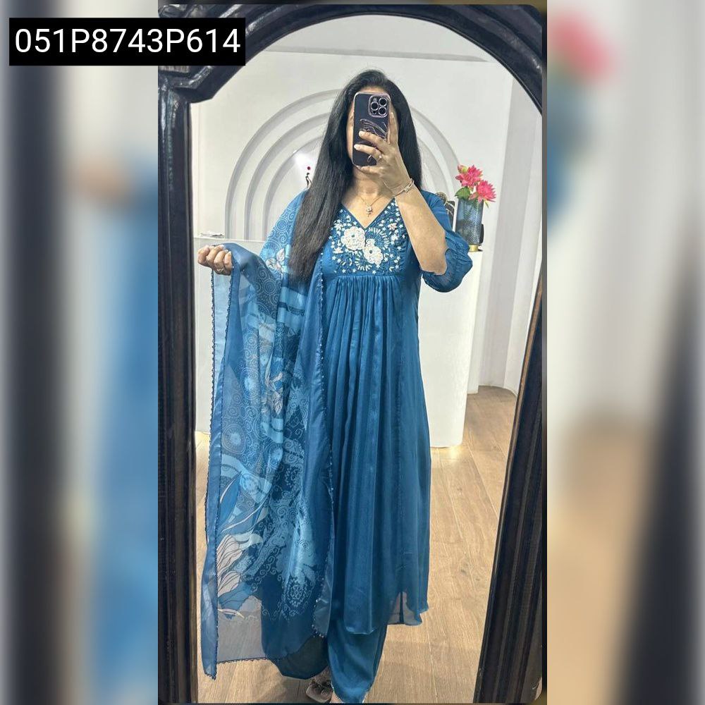 Full body shot of a model wearing the TRENDBUY teal embroidered Vichitra silk gown and plazzo set with matching Taby silk dupatta, posing in a mirror.