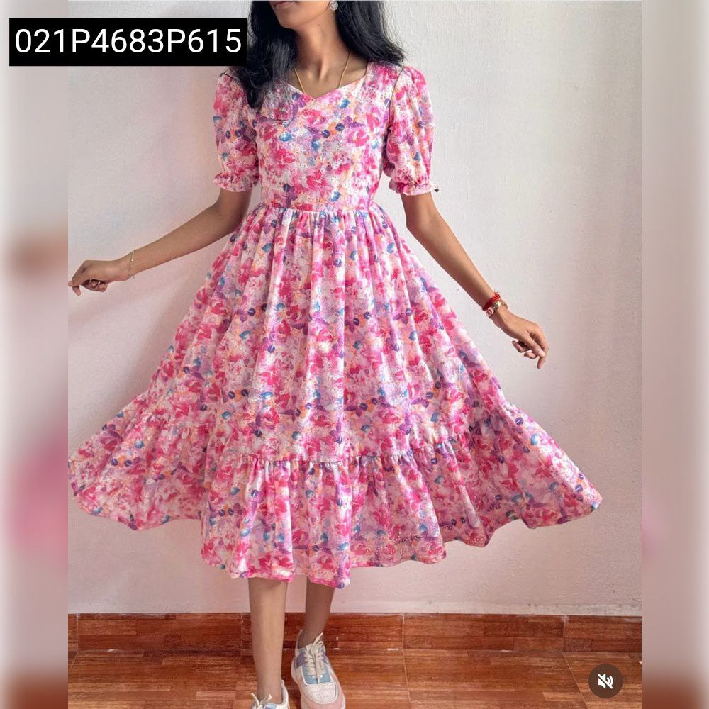 Model twirling in TRENDBUY pink floral Hakoba maxi dress with square neck