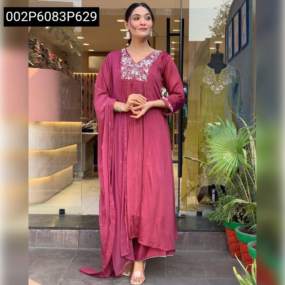 Full body shot of a woman modeling a maroon Chinon Anarkali kurta set with white intricate embroidery on the neckline and sleeve cuffs, standing casually.