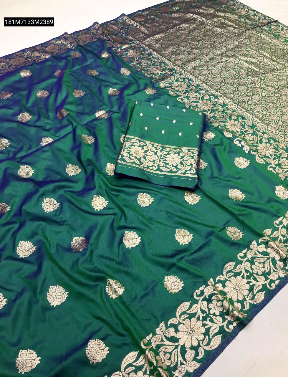 TRENDBUY Teal Green Banarasi Silk Saree with intricate gold zari weaving, heavy floral border, and traditional motifs.