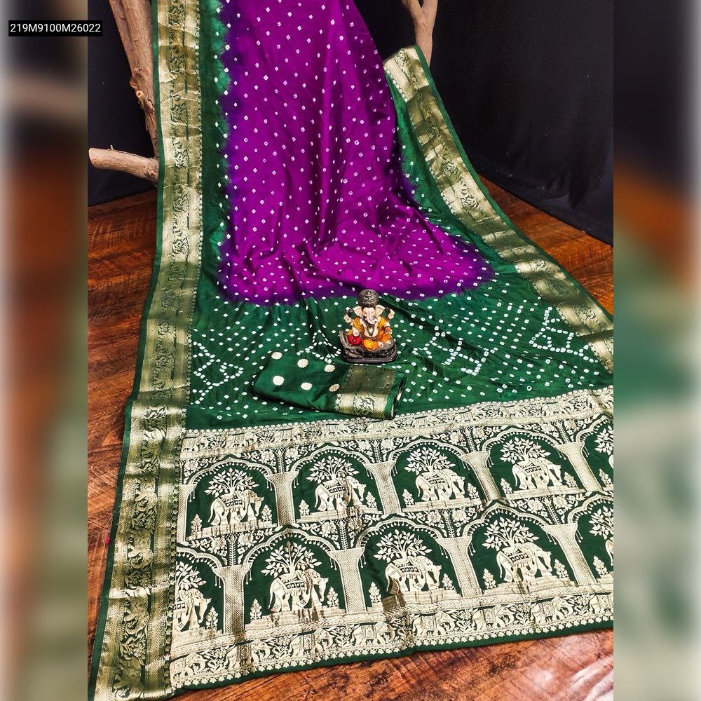 TRENDBUY Bandhej silk saree in vibrant purple and deep green, featuring a gold zari elephant border and traditional white dot patterns.