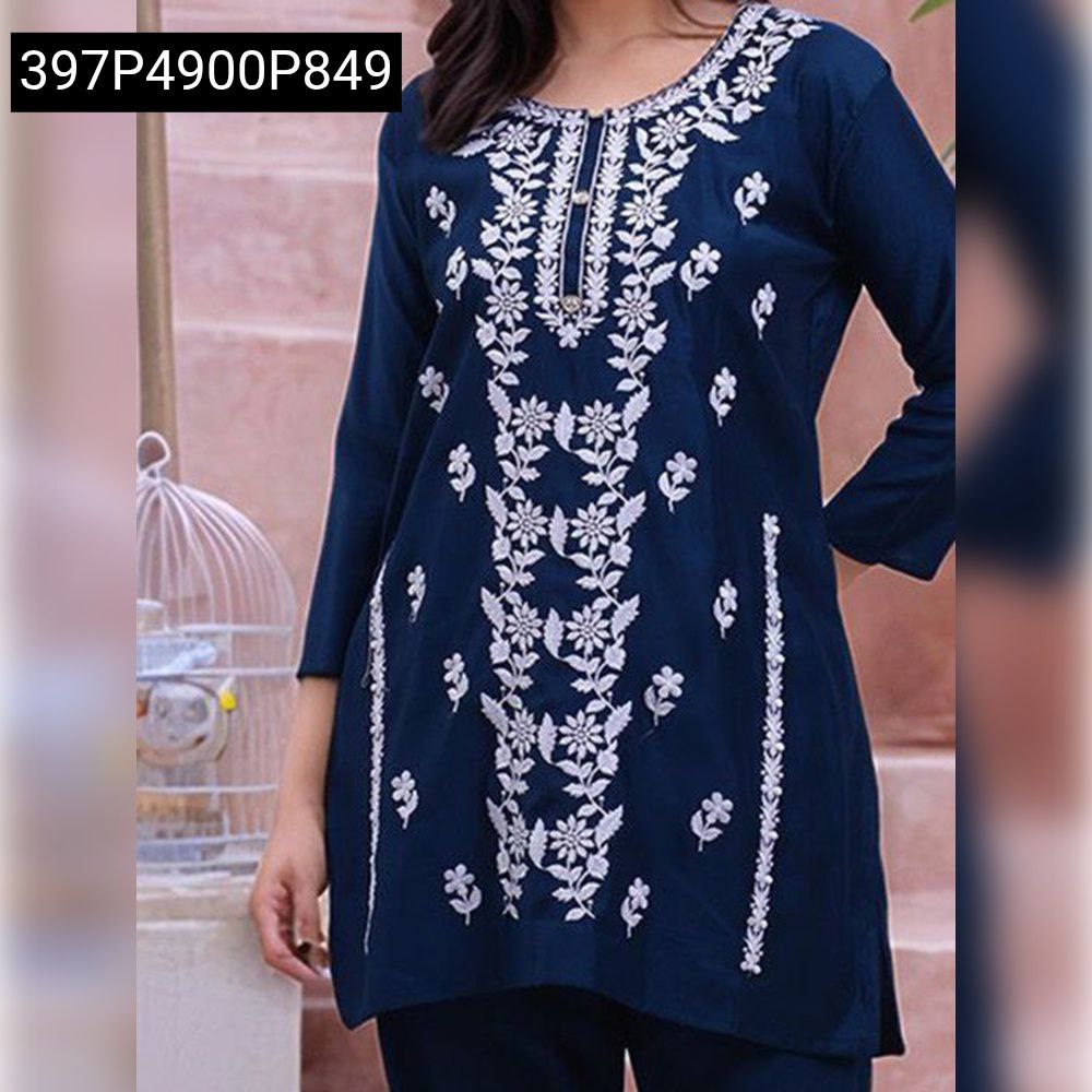 Front view of a model wearing a navy blue rayon kurta with intricate white embroidery.