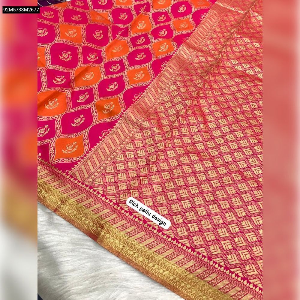 Close-up of the TRENDBUY Hot Pink and Orange Banarsi Silk Saree pallu, showcasing the intricate gold weaving and traditional design with 'Rich pallu design' overlay.