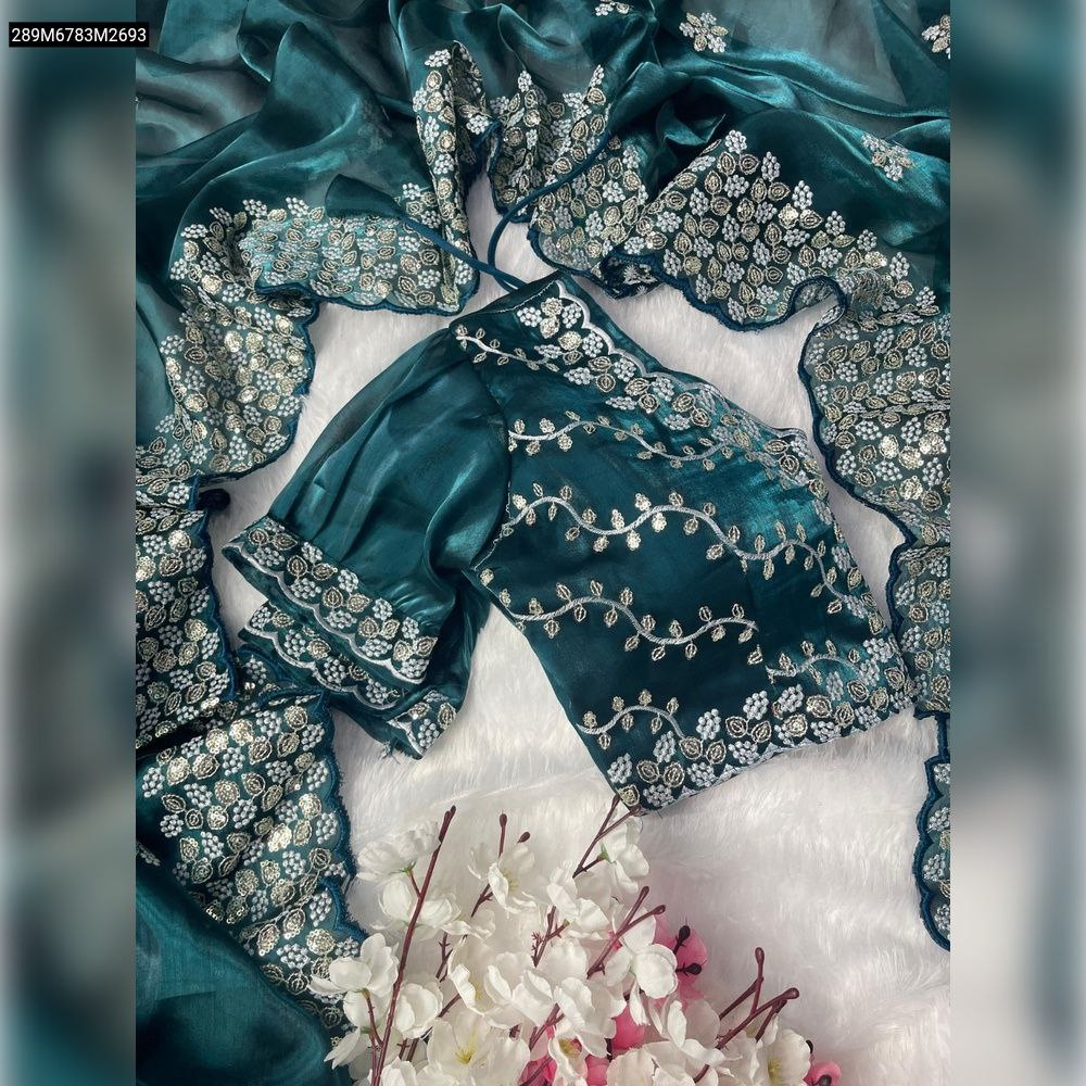 TRENDBUY Teal Green Zimmy Choo silk saree with silver 3mm sequence and vine embroidery work, blouse in foreground.