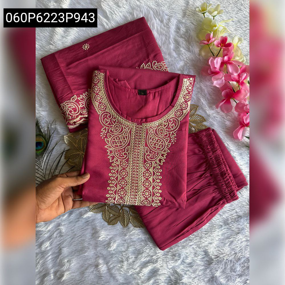Mauve Pink Roman Silk Kurti Pant Set with Dupatta, neatly folded on white faux fur.