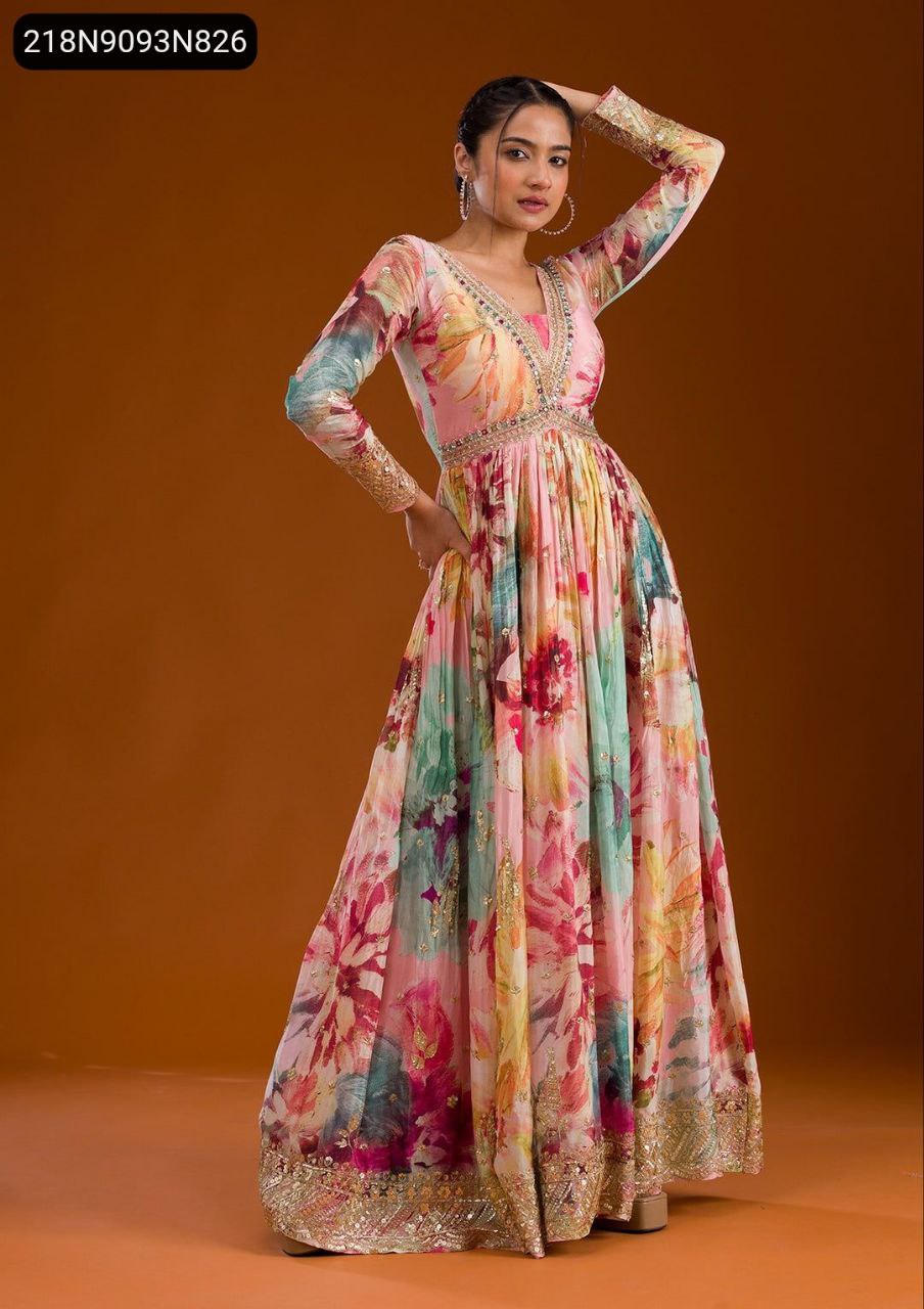 Woman posing gracefully in a multi-color floral Anarkali gown with sequin embroidery, V-neck, and full sleeves.