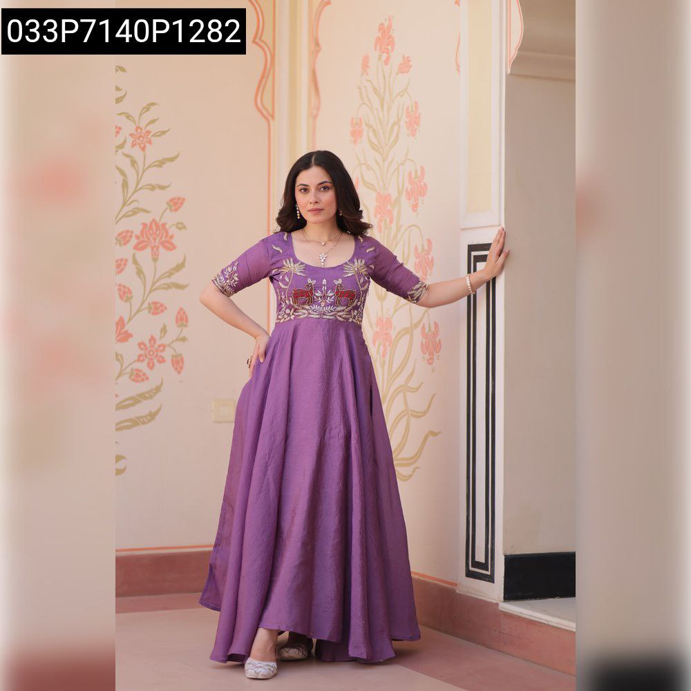 Full shot of a model gracefully posing in a lavender gold crush embroidered women's gown, showcasing its full flair and design.