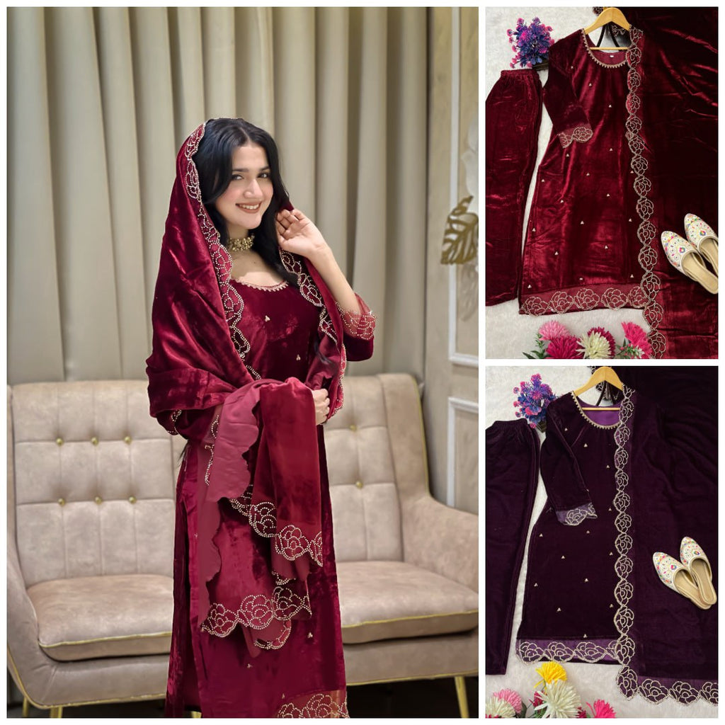 Model in stunning Maroon velvet suit with intricate rhinestone and embroidery work, posing elegantly for a party.