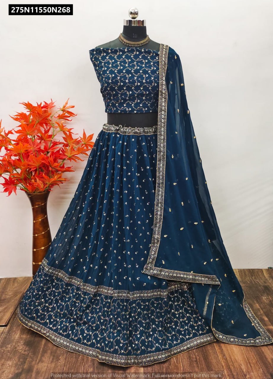 TRENDBUY Teal Blue Georgette Lehenga Choli with foil print and light blue sequence embroidered dupatta, displayed on a mannequin, front view.