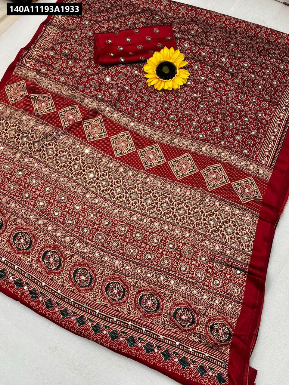 TRENDBUY Red Semi Gajji Bandhej Silk Saree with Mirror Work, flat lay on white background with sunflower