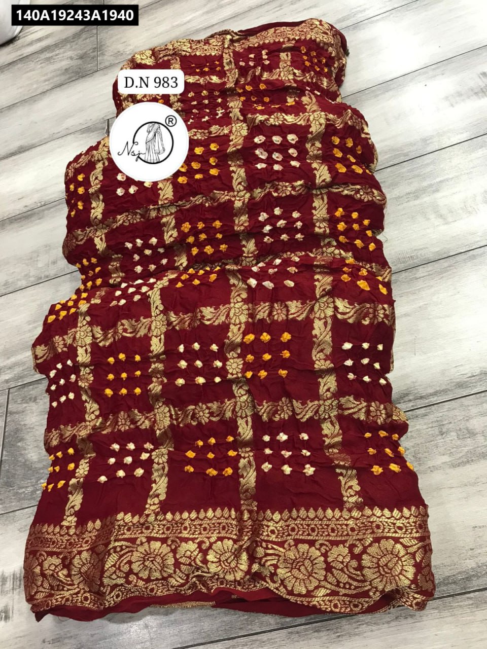 TRENDBUY Maroon Modal Gajji Silk Saree with Garchola Bandhej and Zari Weaving, flat lay view