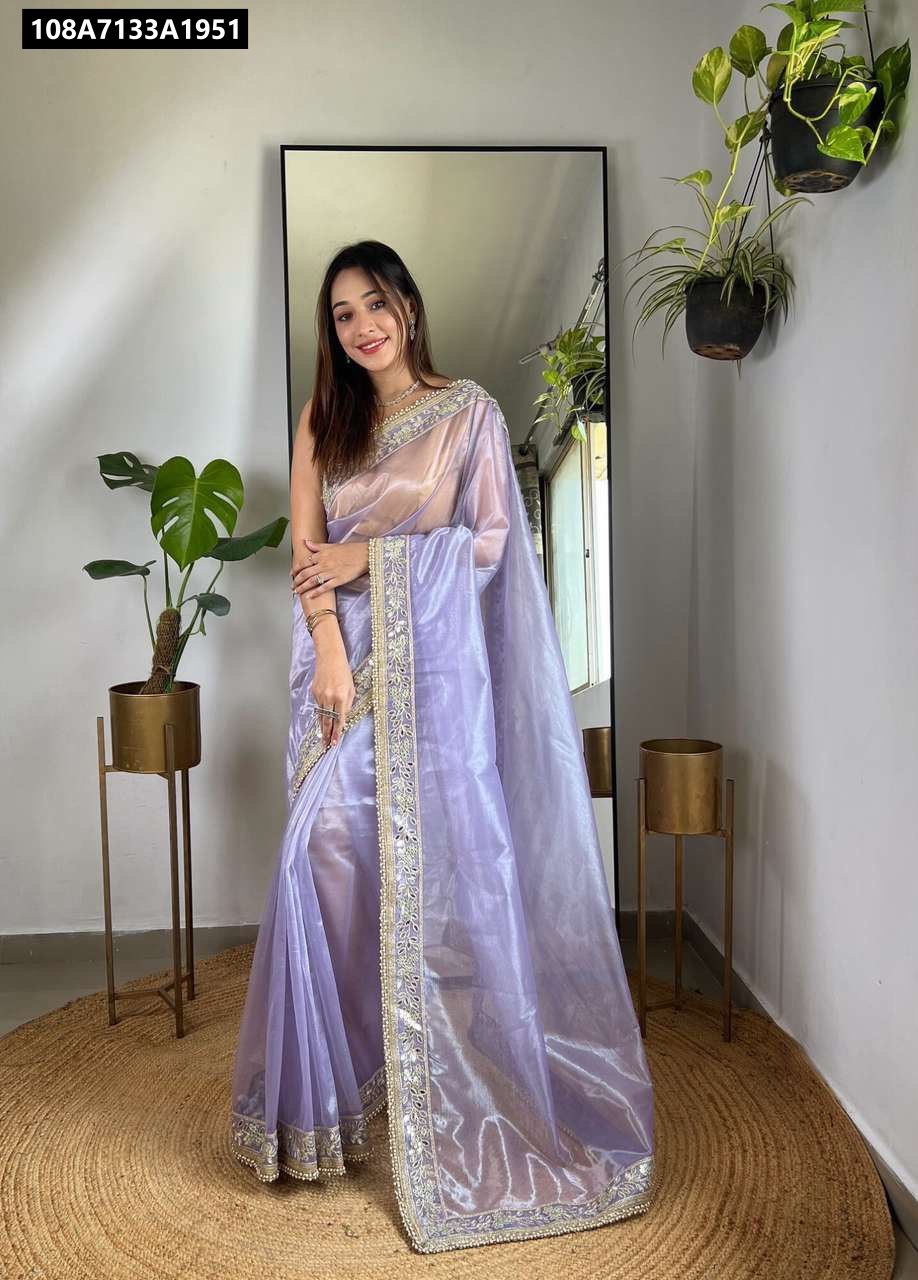 Full shot of model wearing elegant Lavender Twill Net Saree with mirror work and embroidery, front view