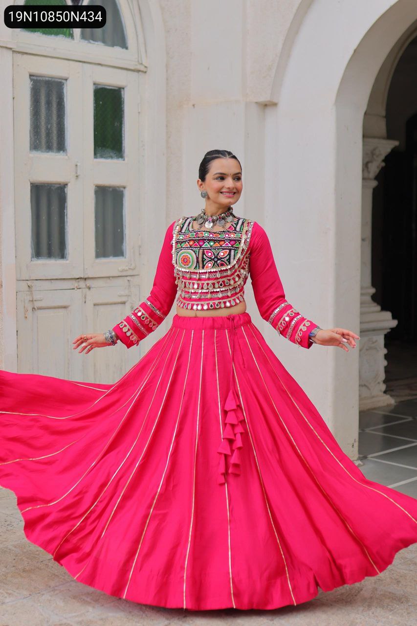Model gracefully twirling in a pink TRENDBUY Roman fabric lehenga choli, emphasizing the wide 6-meter flair and the shimmering Gota-Patti work, ideal for Garba and Dandiya dances.
