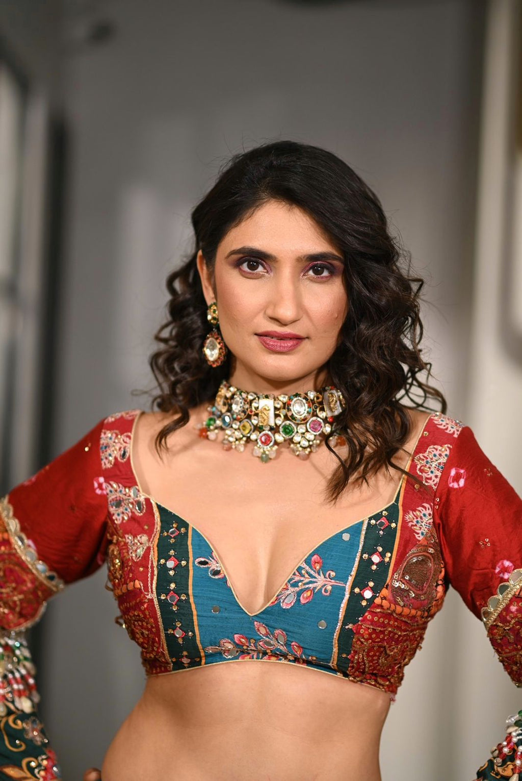 Close-up of model showcasing the intricate multi-colored mirror work and digital print on the TRENDBUY Chaniya Choli blouse.