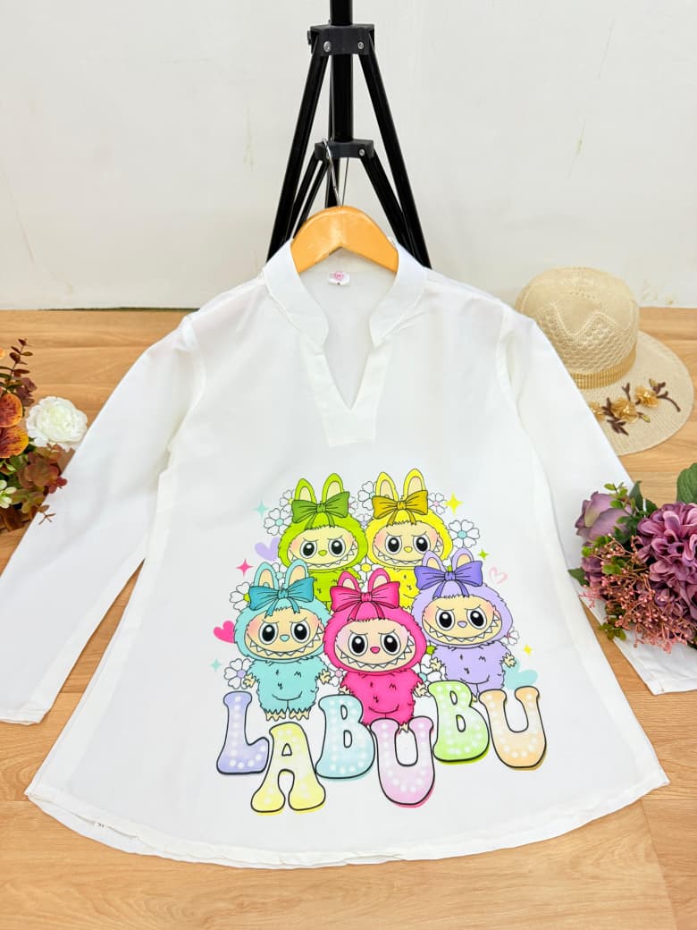White Reyon top with Labubu friends group digital print and 'LABUBU' text, on a hanger.
